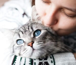 Woman Kissing Cat